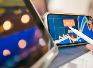 Trader working across multiple markets while analysing Bitcoin Ethereum and forex options